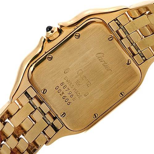 This image shows the back case and partial bracelet of a Cartier Panthere Yellow Gold Silver Dial Yellow Gold Silver Dial watch viewed from an angle.