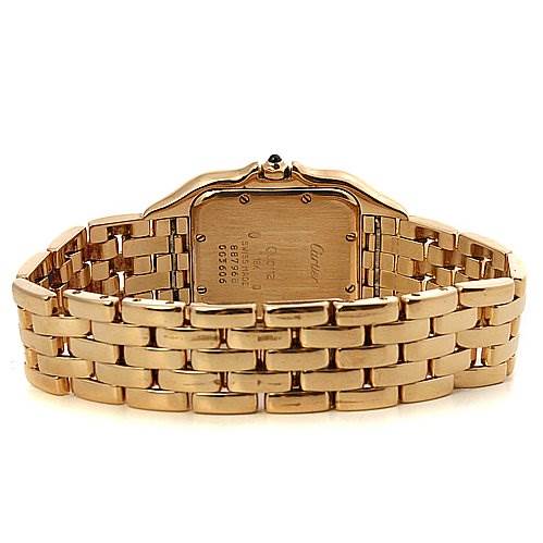 The image shows the back side of a Cartier Panthere Yellow Gold Silver Dial Yellow Gold Silver Dial watch, focusing on the case back and the gold link bracelet.