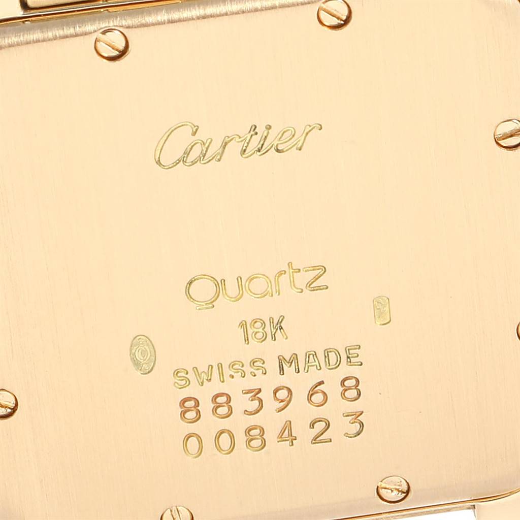 This image shows the back case of a Cartier Panthere W25014B9 Yellow Gold Silver Dial W25014B9 Yellow Gold Silver Dial watch, highlighting its engravings and screws.