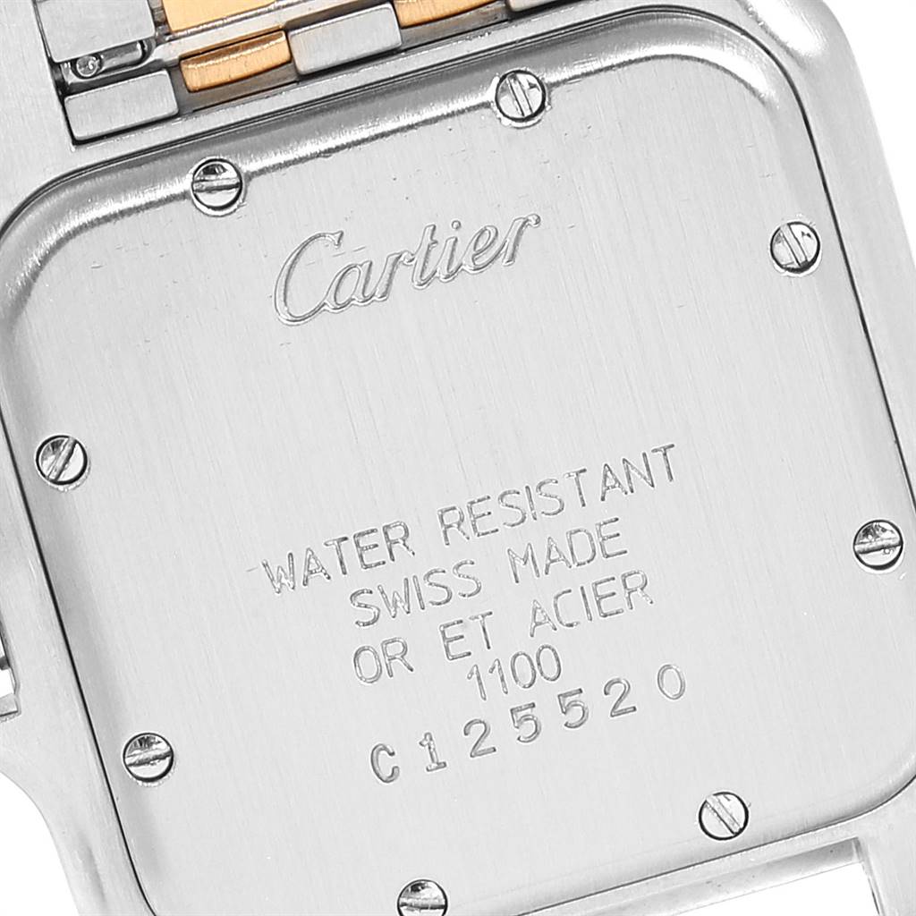 This image shows the back case of a Cartier Panthere W25028B8 Steel and Gold (two tone) Silver Dial W25028B8 Steel and Gold (two tone) Silver Dial watch, focusing on the engraved details and part of the bracelet.