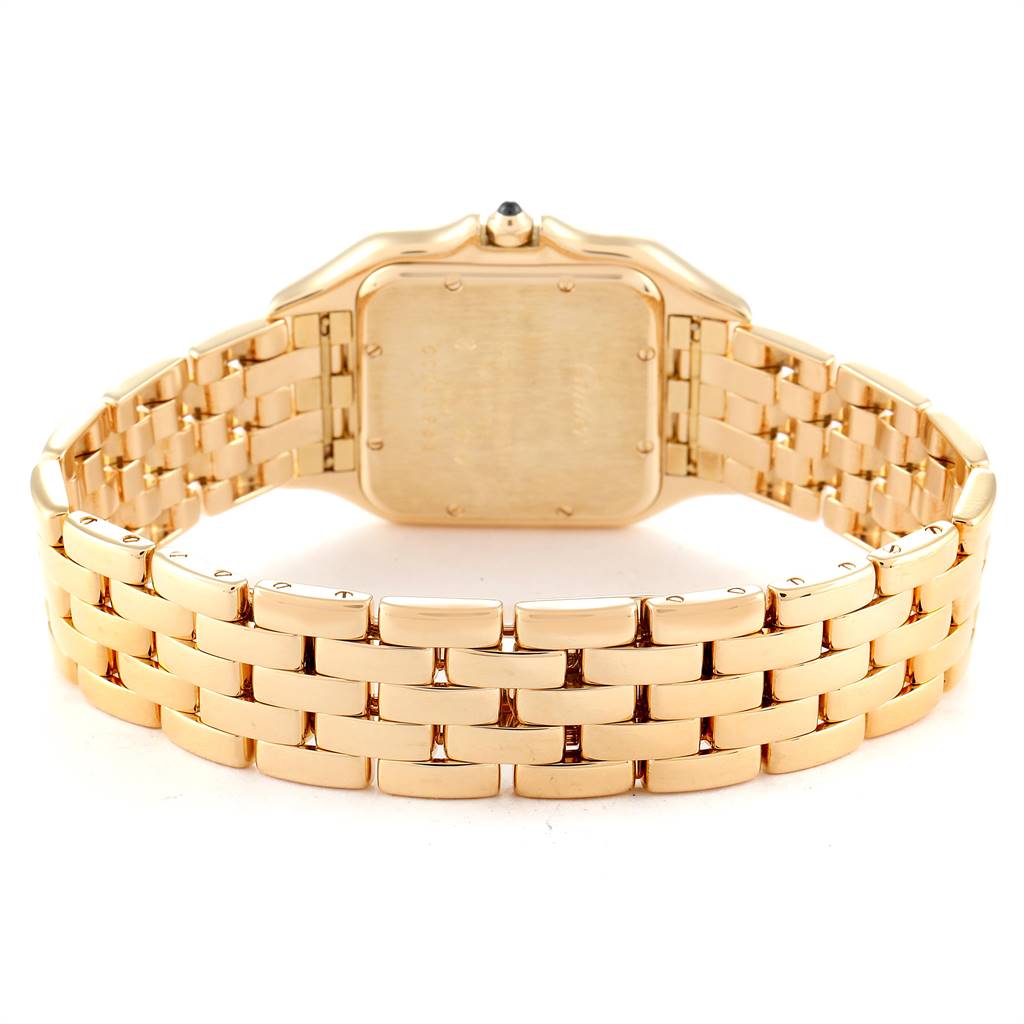 The image shows the back of the case, crown, and gold bracelet of the Cartier Panthere W25014B9 Yellow Gold Silver Dial W25014B9 Yellow Gold Silver Dial watch from a rear angle.