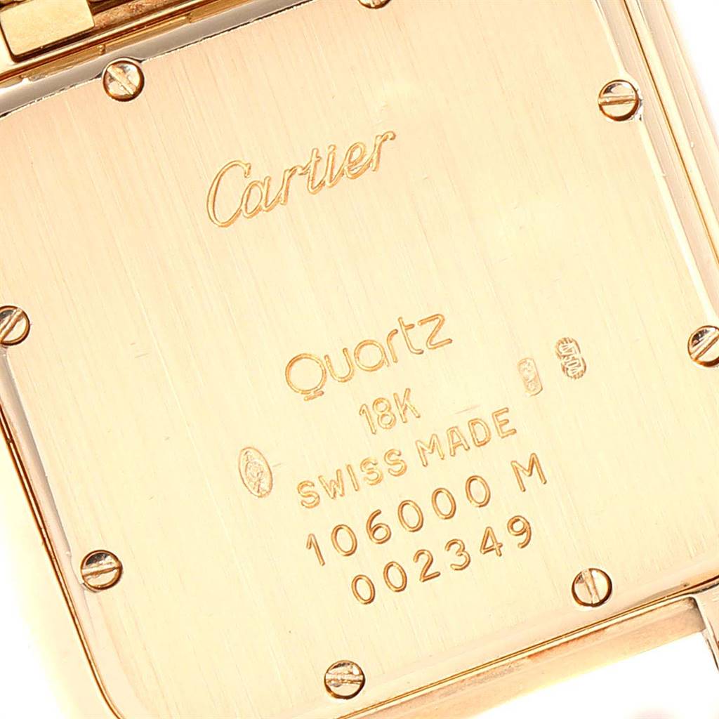 The image shows the back case of a Cartier Panthere W25014B9 Men's Yellow Gold Silver Dial W25014B9 Men's Yellow Gold Silver Dial watch, highlighting its markings and screws.