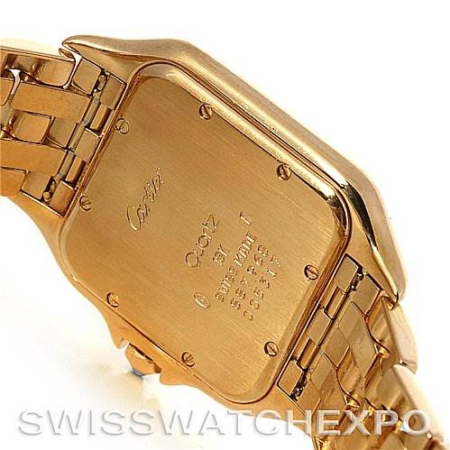 The image shows the back of a Cartier Panthere Yellow Gold Silver Dial Yellow Gold Silver Dial watch, highlighting its case back and part of the gold bracelet.