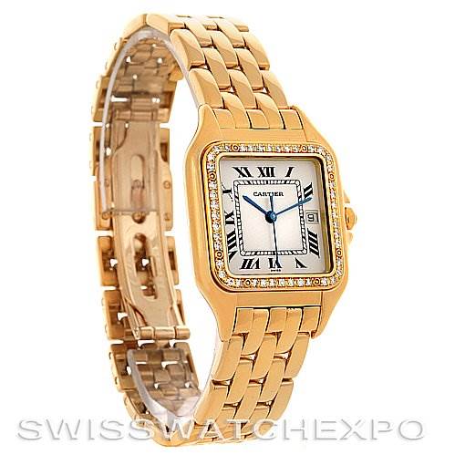 The image shows a Cartier Panthere Men
s Yellow Gold Silver Dial Men
s Yellow Gold Silver Dial model watch in a gold tone displayed at an angled view, highlighting the bracelet and face.
