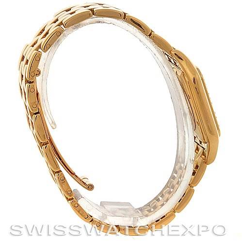 The image shows a side view of the Cartier Panthere Men
s Yellow Gold Silver Dial Men
s Yellow Gold Silver Dial watch, highlighting its gold bracelet and case.