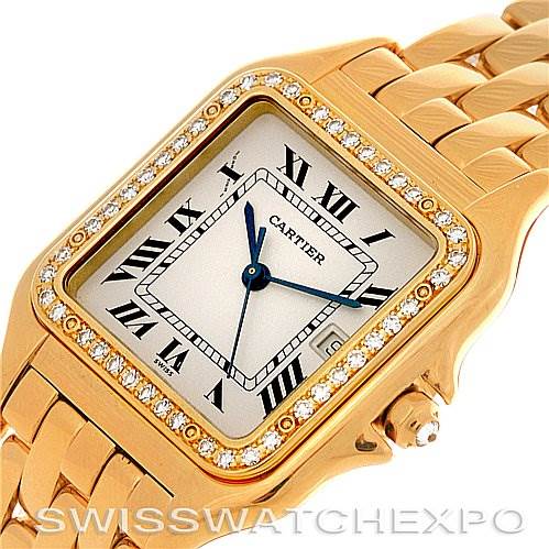 The image shows a close-up of the Cartier Panthère watch, highlighting its gold case, diamond bezel, white dial, blue hands, and part of the bracelet.