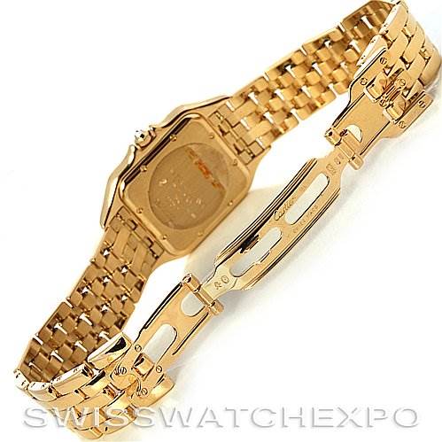 This image shows the back case and open clasp of a Cartier Panthere Men
s Yellow Gold Silver Dial Men
s Yellow Gold Silver Dial watch, highlighting its gold bracelet and deployment clasp.