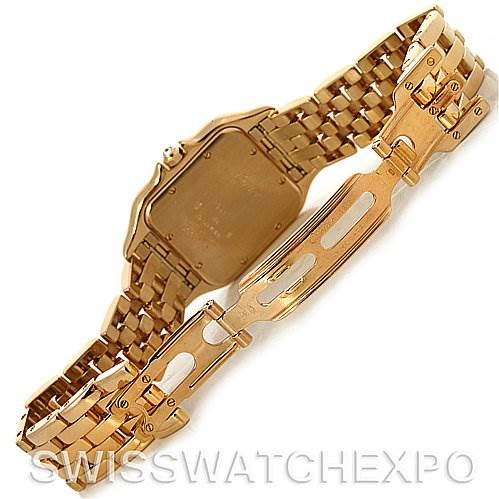 This image shows the underside of the Cartier Panthere W25014B9 Yellow Gold Silver Dial W25014B9 Yellow Gold Silver Dial model watch, highlighting its gold bracelet and clasp.