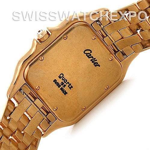 This image shows the back case of a Cartier Panthere Yellow Gold Silver Dial Yellow Gold Silver Dial watch, highlighting the brand name, movement type, and 'Swiss Made' engraving.