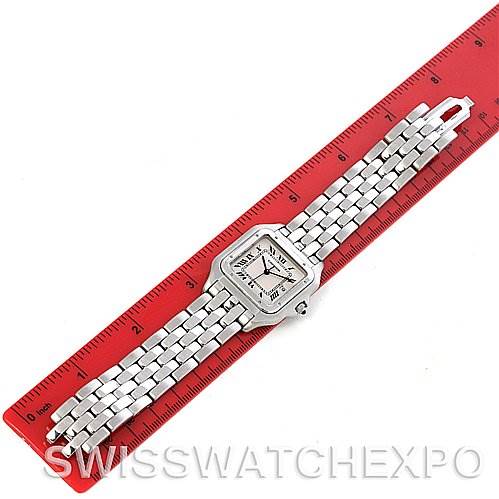 This image shows a Cartier Panthere Men
s Stainless Steel Silver Dial Men
s Stainless Steel Silver Dial model watch placed flat next to a red ruler, highlighting its length.
