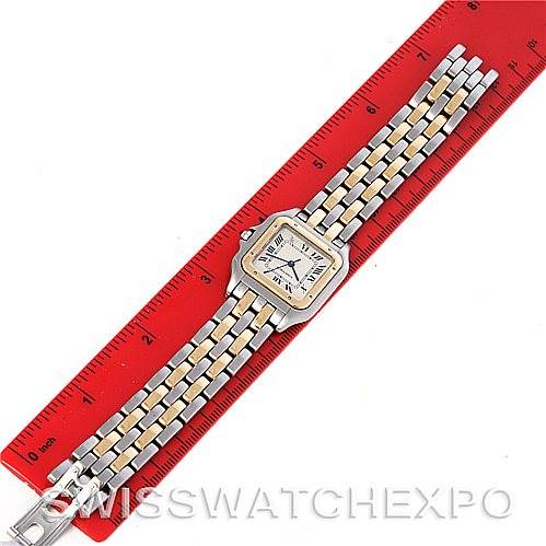 The image shows a top-down view of a Cartier Panthere W25028B6 Steel and Gold (two tone) Silver Dial W25028B6 Steel and Gold (two tone) Silver Dial watch next to a red ruler measuring its length.