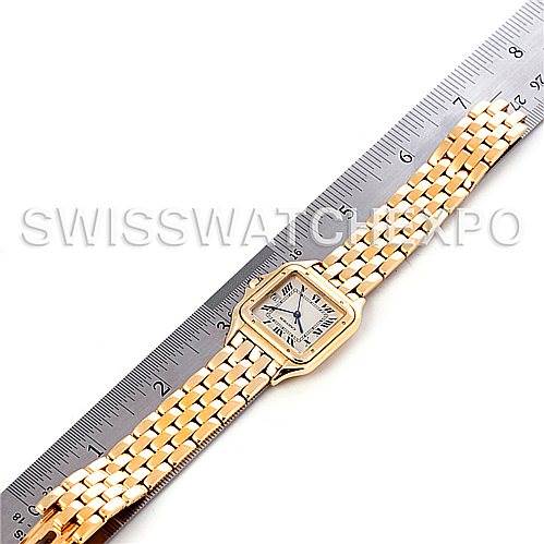 The Panthère de Cartier watch is shown from above, displaying the face, bezel, and bracelet alongside a ruler for scale reference.