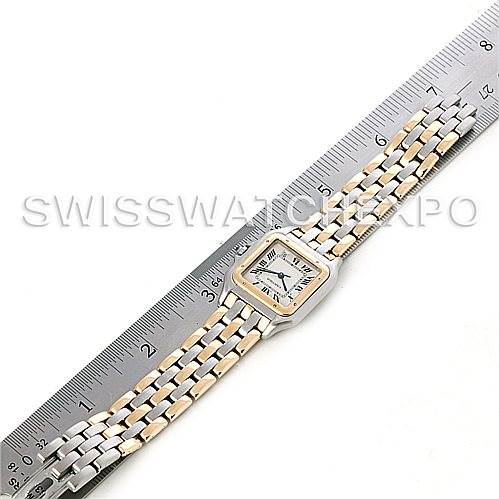 The image shows an overhead view of a Cartier Panthere Men's Steel and Gold (two tone) Silver Dial Men's Steel and Gold (two tone) Silver Dial watch, displaying its face, bezel, and two-tone bracelet alongside a ruler for scale.