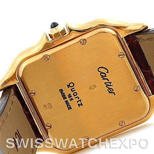 The image shows the back case of a Cartier Panthere W25014B9 Men
s Yellow Gold Silver Dial W25014B9 Men
s Yellow Gold Silver Dial watch, highlighting its 18K gold, "Quartz" label, and "Swiss Made" inscription.