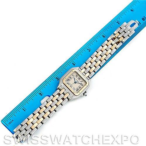 The image shows a Cartier Panthere W25028B6 Men's Steel and Gold (two tone) Beige Dial W25028B6 Men's Steel and Gold (two tone) Beige Dial model watch laid flat with a blue ruler beside it for scale.