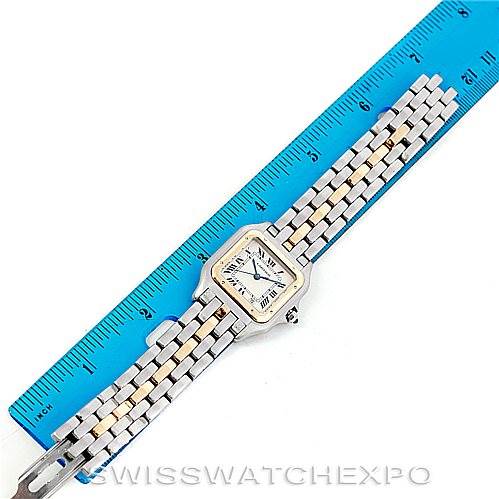 The image shows a Cartier Panthere Men
s Steel and Gold (two tone) Silver Dial Men
s Steel and Gold (two tone) Silver Dial watch laid next to a blue ruler for measurement.