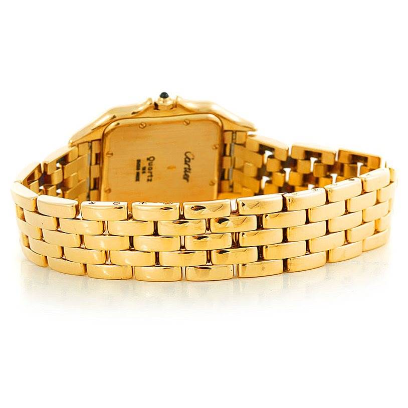 The image shows the back and bracelet of a Panthere model by Cartier, focusing on the gold links.