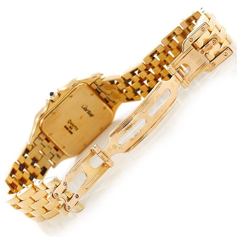 This image shows the back and inside of the gold bracelet of a Cartier Panthere W25014B9 Men
s Yellow Gold Silver Dial W25014B9 Men
s Yellow Gold Silver Dial watch, highlighting the clasp mechanism.