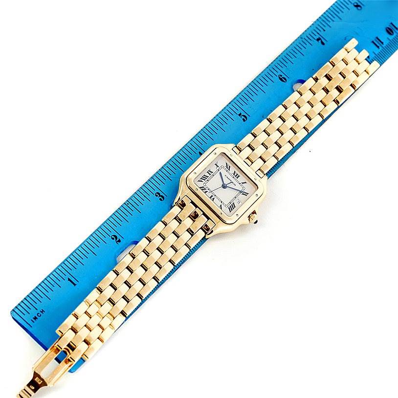 The Cartier Panthere W25014B9 Men's Yellow Gold Silver Dial W25014B9 Men's Yellow Gold Silver Dial model watch is shown from a top-down angle, displaying its face and gold bracelet.