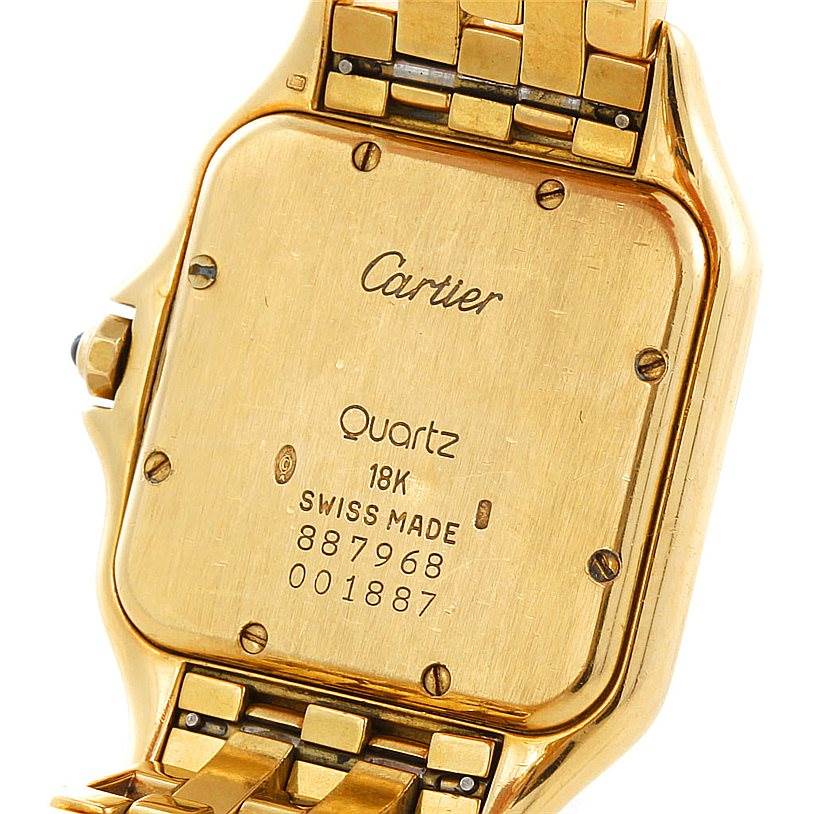 The image shows the back case of a Cartier Panthère watch, displaying its inscriptions and part of the bracelet.