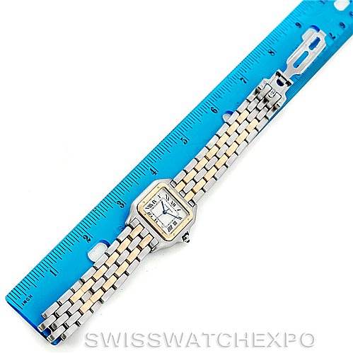 This image shows a top-down view of a Cartier Panthere W25028B6 Men's Steel and Gold (two tone) Beige Dial W25028B6 Men's Steel and Gold (two tone) Beige Dial watch next to a blue ruler.