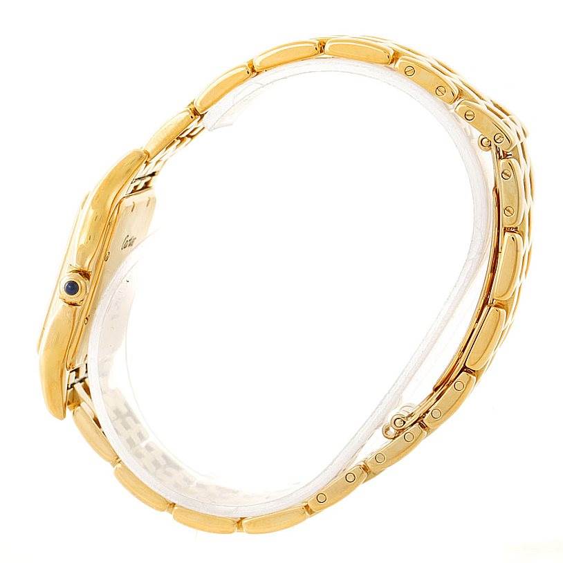 The image shows a side view of the Cartier Panthere W25014B9 Men's Yellow Gold Silver Dial W25014B9 Men's Yellow Gold Silver Dial watch, highlighting its gold bracelet and crown with a blue cabochon.