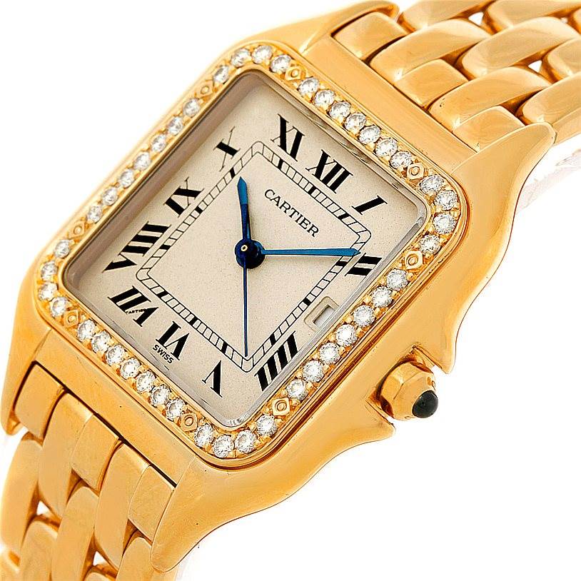 The image shows an angled close-up of the face and bracelet of a Cartier Panthere Yellow Gold Silver Dial Yellow Gold Silver Dial watch, highlighting the diamond bezel and gold links.