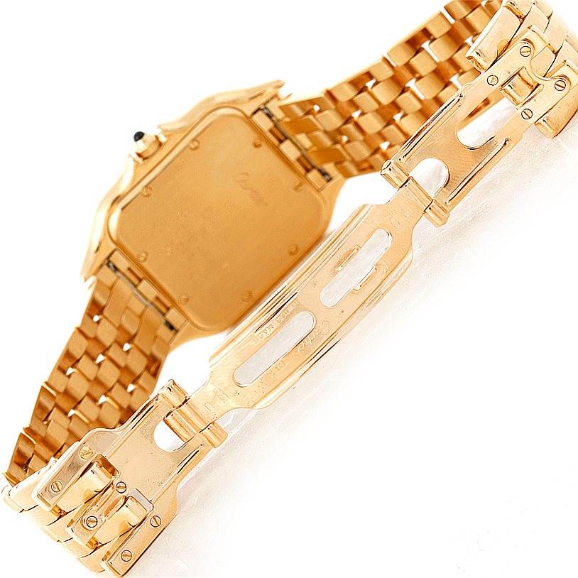 This image shows the back view and clasp of a Cartier Panthere Yellow Gold Silver Dial Yellow Gold Silver Dial model watch, highlighting its gold bracelet and deployment buckle.