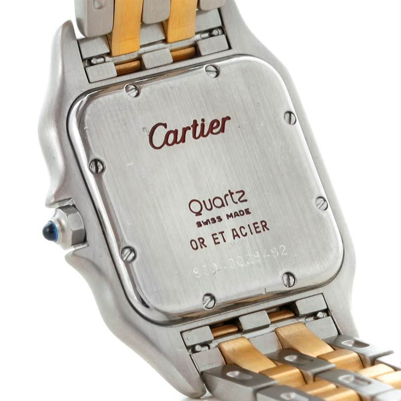 The image shows the back case and part of the two-tone bracelet of the Panthere model by Cartier.