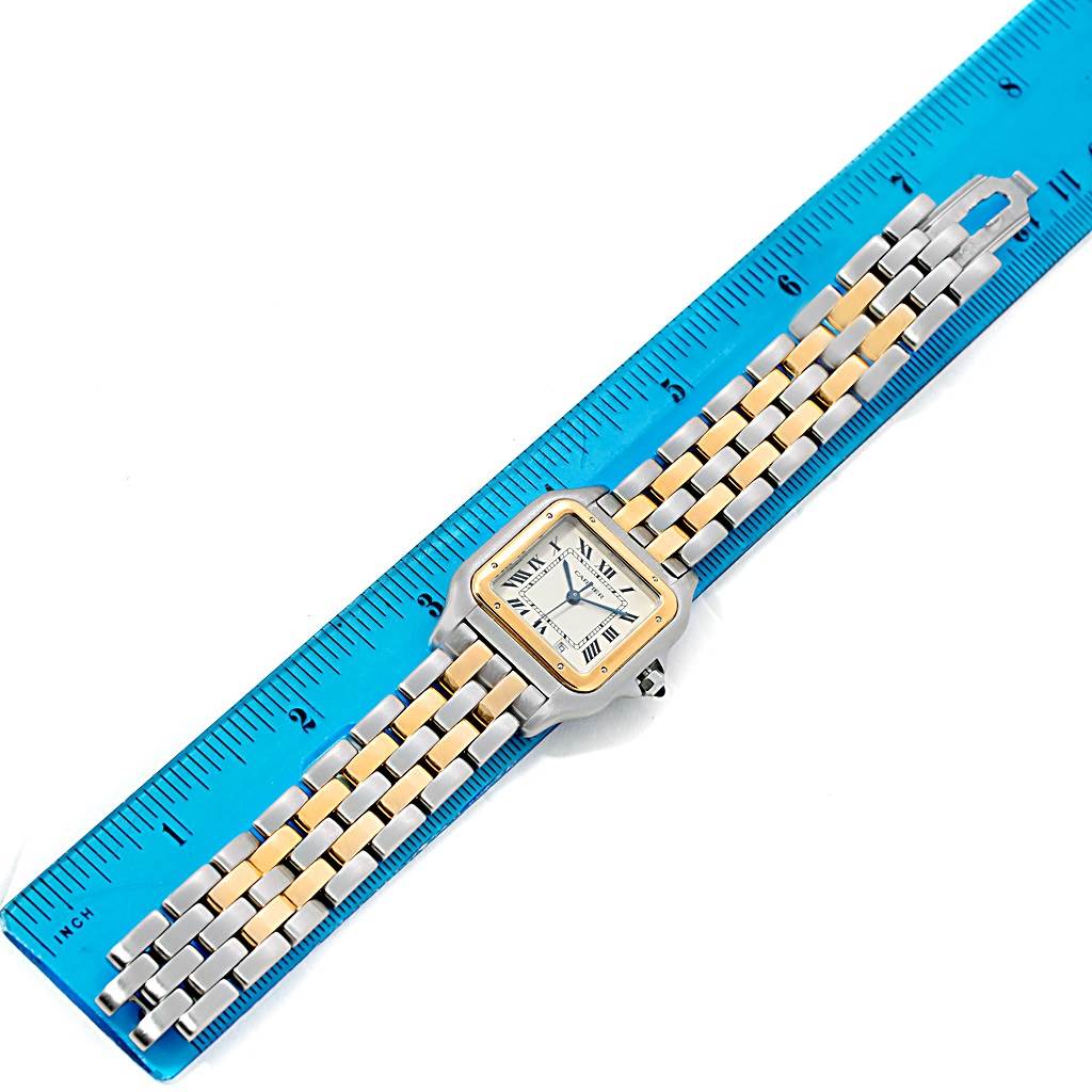 The image shows a top-down view of a Cartier Panthere W25028B6 Steel and Gold (two tone) Silver Dial W25028B6 Steel and Gold (two tone) Silver Dial watch placed on a ruler for size reference.
