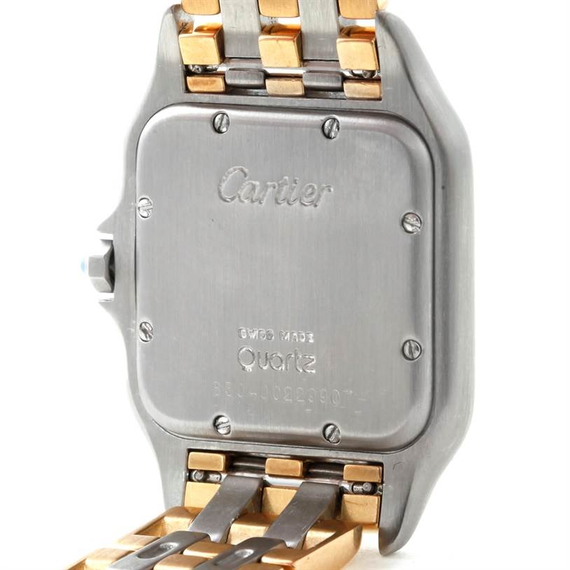 This image shows the back case and part of the bracelet of a Cartier Panthere W25028B8 Steel and Gold (two tone) Beige Dial W25028B8 Steel and Gold (two tone) Beige Dial watch, with visible screws and inscriptions.