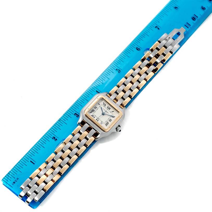 The Cartier Panthere W25028B8 Steel and Gold (two tone) Beige Dial W25028B8 Steel and Gold (two tone) Beige Dial watch is shown from an overhead angle, placed alongside a blue ruler.