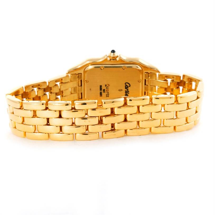 The image shows the back of a Panthere model by Cartier, highlighting the gold bracelet and case back.