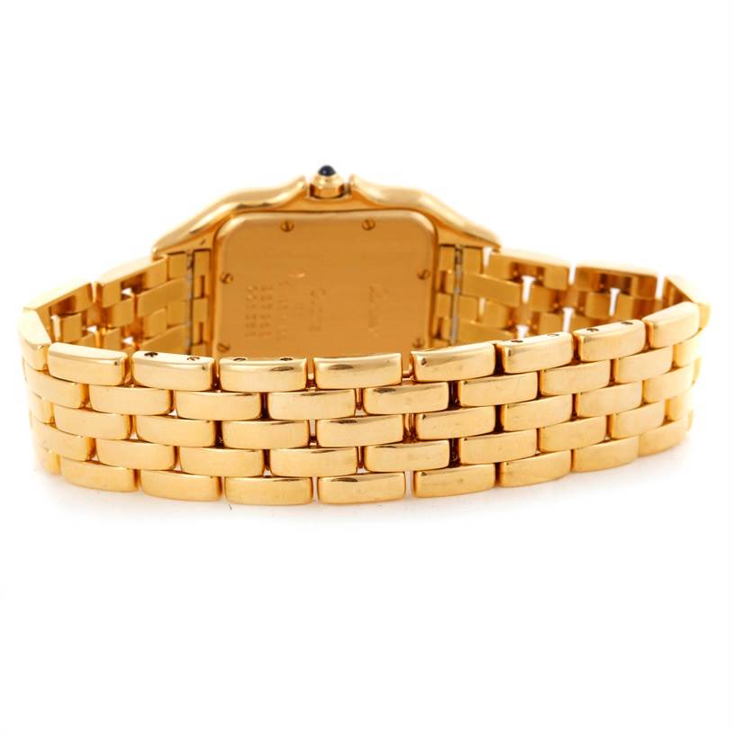 This image shows the back side of a Panthere model by Cartier, highlighting its gold bracelet and caseback.