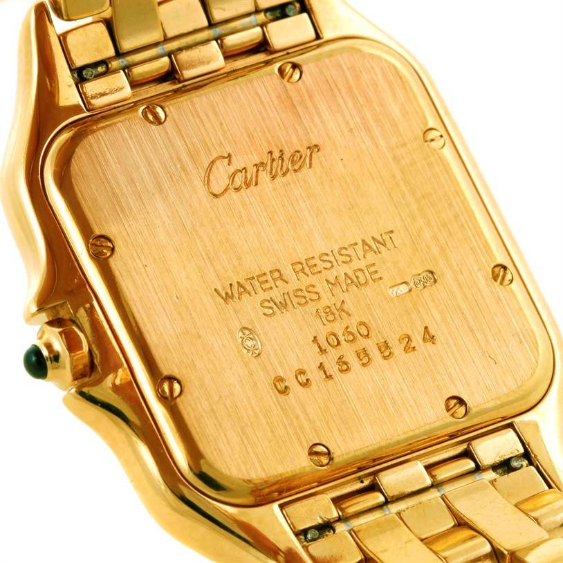 The image shows the back of a Panthere model watch by Cartier, highlighting its gold casing and details.