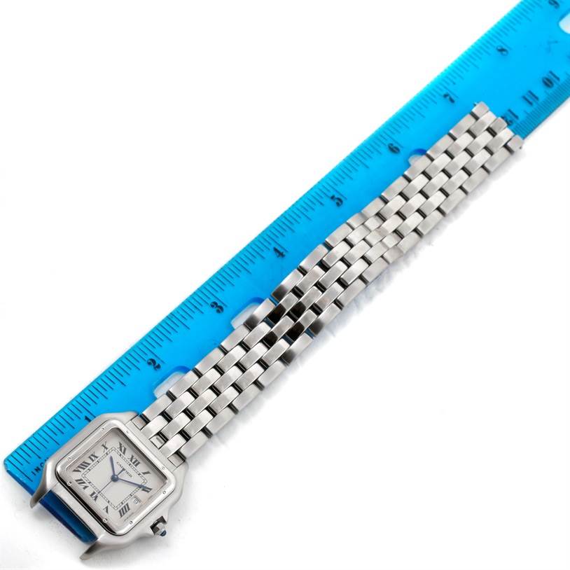 The image shows a Cartier Panthere W25032P5 Men
s Stainless Steel Silver Dial W25032P5 Men
s Stainless Steel Silver Dial model watch laid flat alongside a ruler, displaying the watch face and metal bracelet.