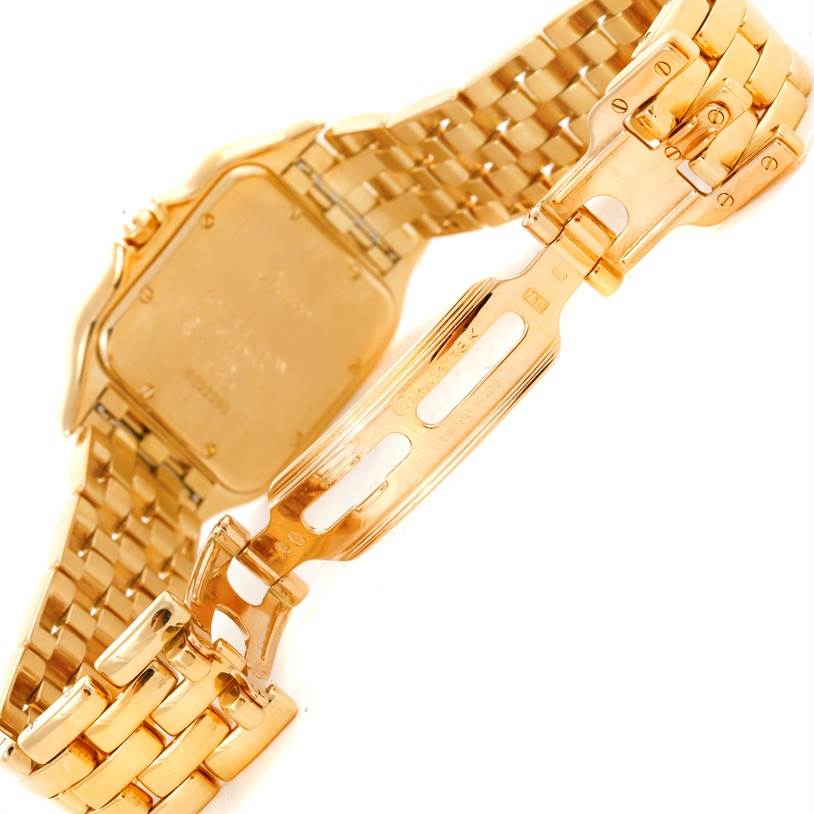 The image shows the back side and deployment clasp of a Cartier Panthere Men's Yellow Gold Silver Dial Men's Yellow Gold Silver Dial watch, with its gold bracelet partially open.