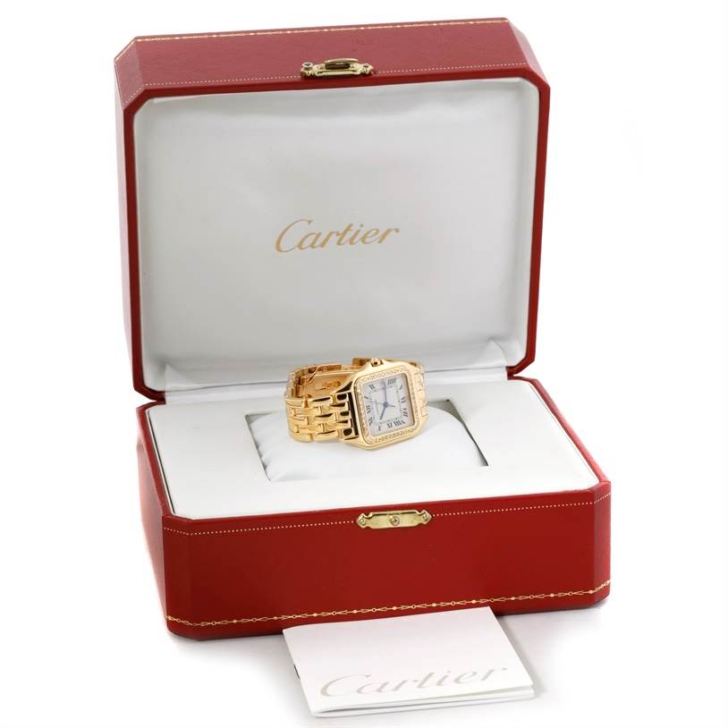 The Cartier Panthère watch is shown angled top-down, inside its open red and white Cartier box.