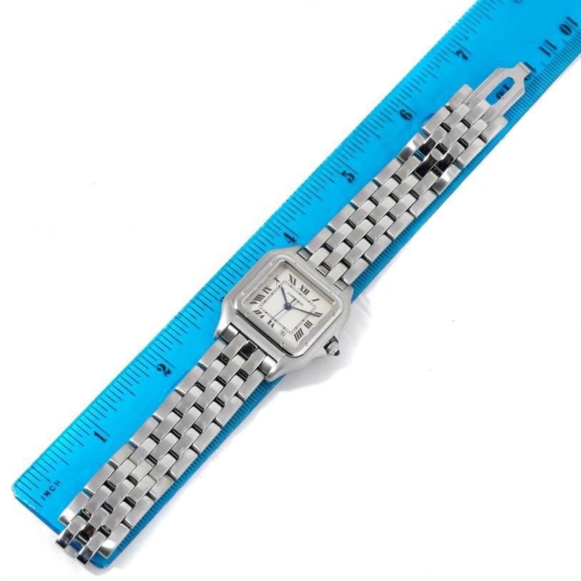 The Cartier Panthere W25054P5 Men
s Stainless Steel Silver Dial W25054P5 Men
s Stainless Steel Silver Dial watch is shown from a top-down angle, with the face and entire band visible against a ruler.