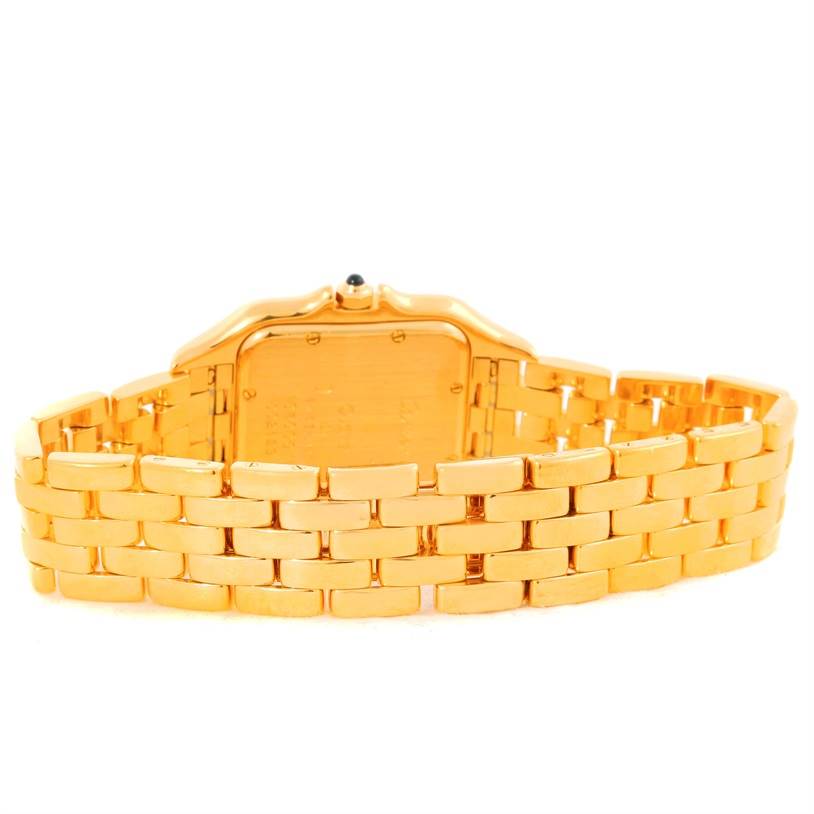 The image shows the back of a Cartier Panthere W25014B9 Men's Yellow Gold Silver Dial W25014B9 Men's Yellow Gold Silver Dial watch with a gold bracelet band.