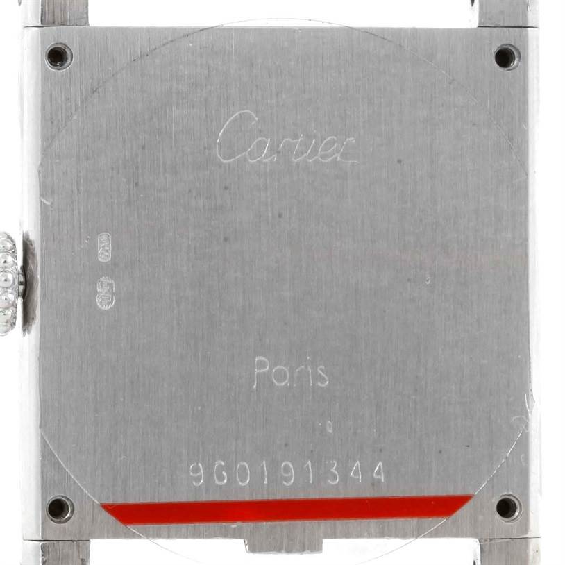 This is a close-up view of the back case of a Cartier Tank Classic Men's White Gold Beige Dial Men's White Gold Beige Dial watch.