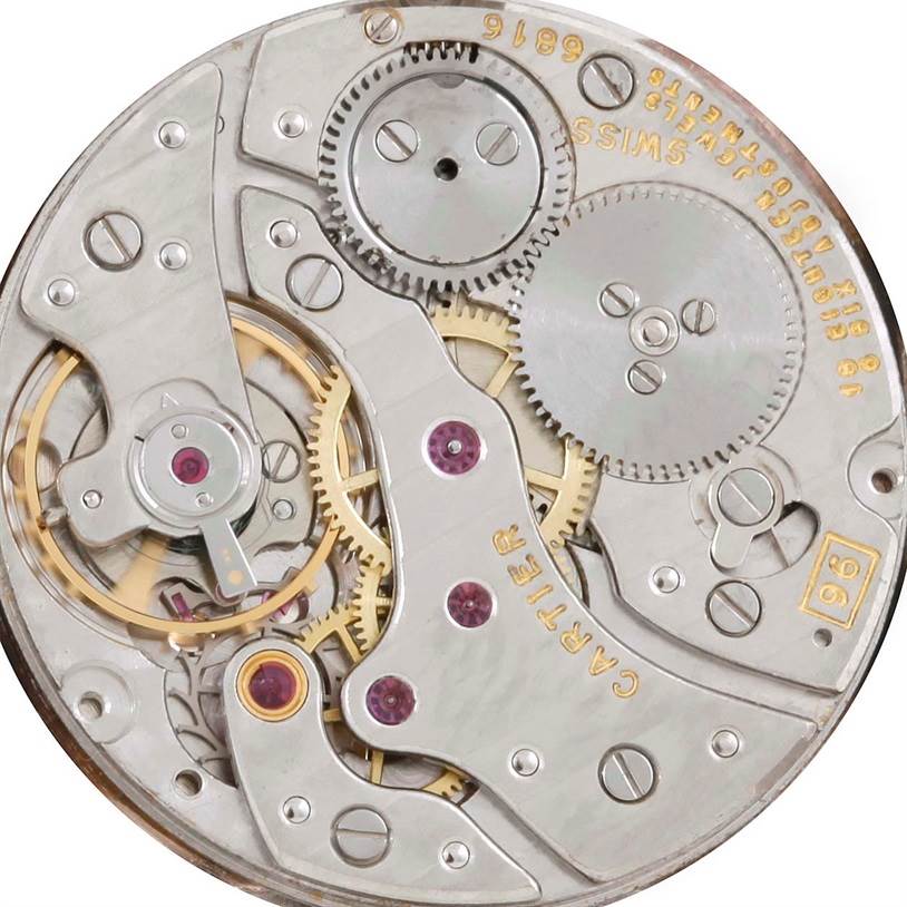 This image shows the inner mechanical movement parts of a Cartier Tank Classic Men's White Gold Beige Dial Men's White Gold Beige Dial watch from a top-down angle.