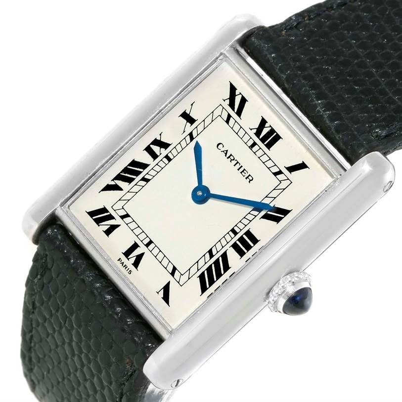 This image shows a Cartier Tank Classic Men's White Gold Beige Dial Men's White Gold Beige Dial watch face from a slight angled top-down view, displaying the dial, hands, and part of the strap.