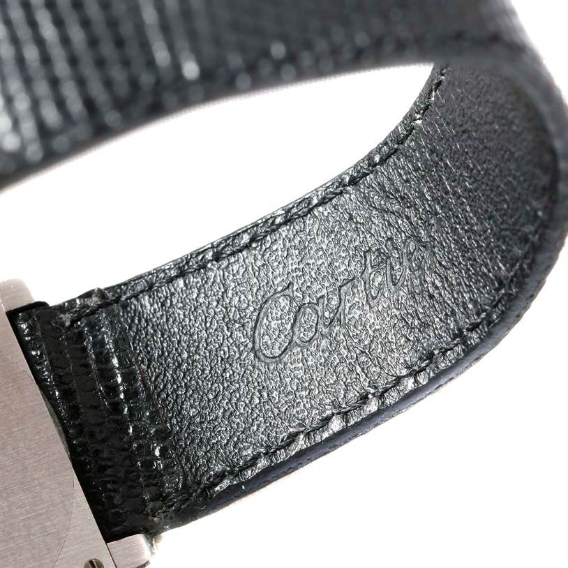 The image shows a close-up of the leather strap and part of the case of a Cartier Tank Classic Men's White Gold Beige Dial Men's White Gold Beige Dial watch.