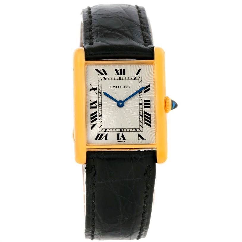 The image shows a front view of a Cartier Tank Classic Men's Yellow Gold Silver Dial Men's Yellow Gold Silver Dial model watch with a rectangular gold case and black leather strap.
