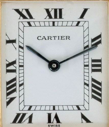 The image shows a close-up of the Cartier Tank Classic Men
s Steel and Gold (two tone) White Dial Men
s Steel and Gold (two tone) White Dial watch face, displaying its Roman numerals, hands, and brand name.