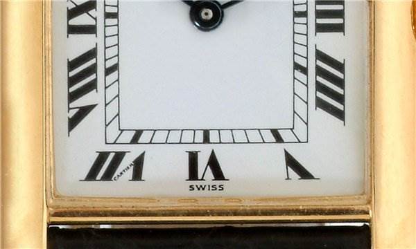 This close-up angle shows the dial and Roman numerals of the Cartier Tank Classic Men
s Steel and Gold (two tone) White Dial Men
s Steel and Gold (two tone) White Dial watch.