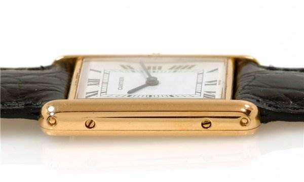 This image shows a side view of the Cartier Tank Classic Men
s Steel and Gold (two tone) White Dial Men
s Steel and Gold (two tone) White Dial model watch, highlighting its rectangular case and strap attachments.