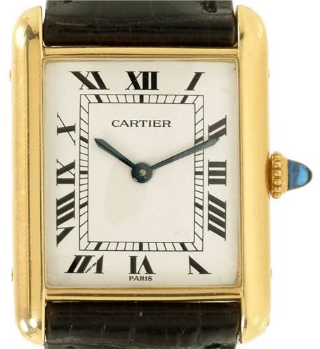 This image shows a front view of the Cartier Tank Classic Yellow Gold White Dial Yellow Gold White Dial watch, displaying its dial, hands, and a segment of the strap.