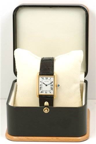 The image shows a Cartier Tank Classic Yellow Gold White Dial Yellow Gold White Dial watch from the front, placed in a padded case with the watch face and strap visible.